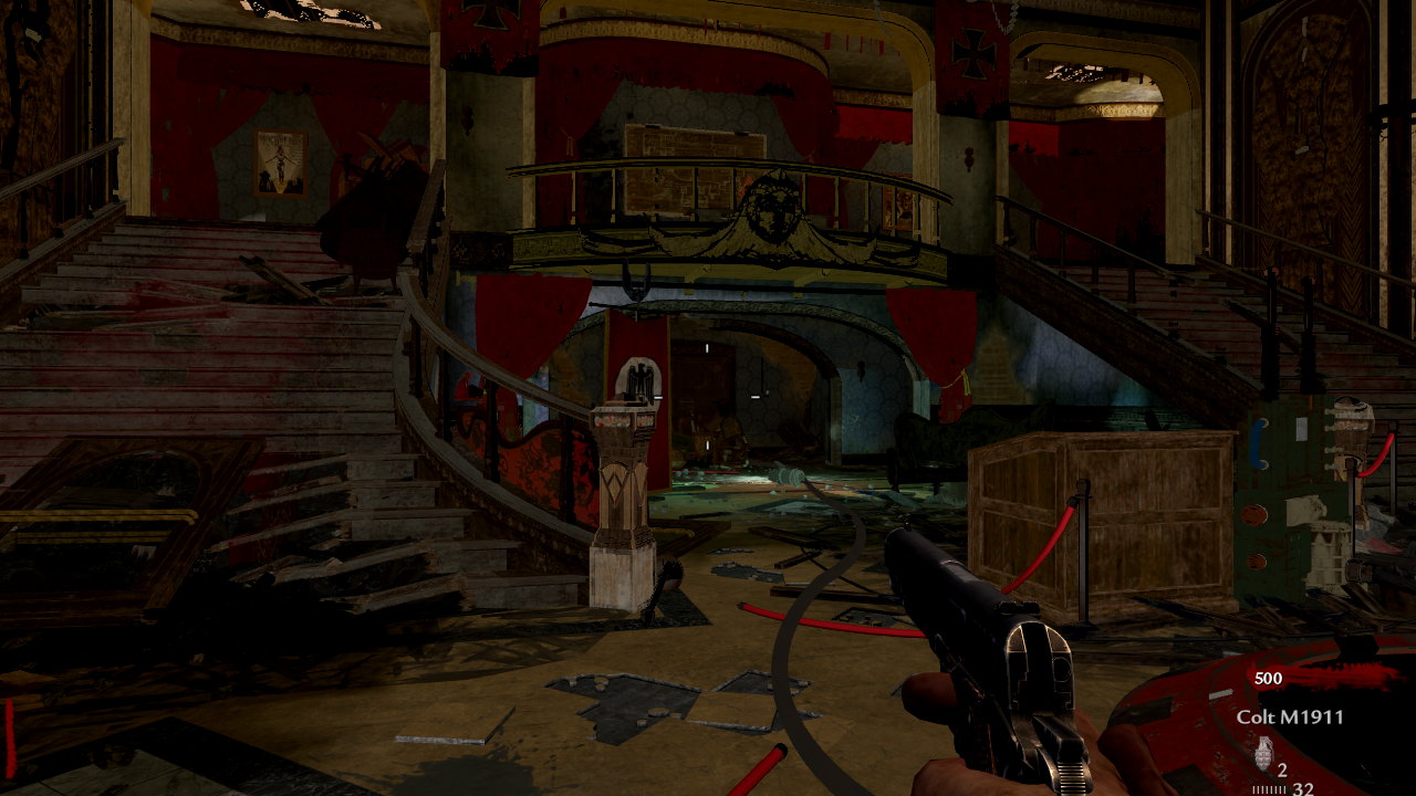 The Kino der Toten lobby in the browser edition: twin staircases, the balcony and the doors toward the stage, pistol in hand.